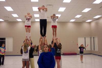 The opening stunt of our routine. 3 awesomes , they look AWESOME!