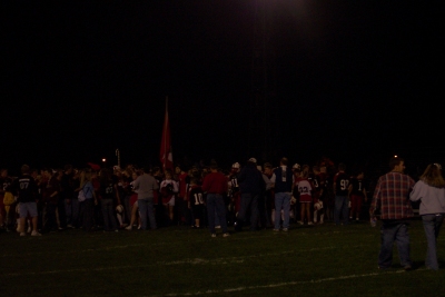 The fans & cheerleaders rushed the field at the end of the game to congratulate the players on another homecoming victory.