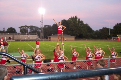 Varsity cheerleaders start off the game with a stund & chant.