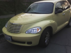 Here is a camera phone photo of my Dijon Yellow PT Cruiser.  The educator from Aberdeen High School who I had been working with, loved the car when she saw it, so did my Aunt.  I then gave up the idea of buying one.  Photo taken on March 22, 2007.