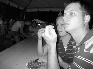 A photo of Brian and Traci grubbing on a funnel cake.  Believe it or not, this was Traci's first funnel cake.  Photo by Nick Peyton, taken August 26, 2006.