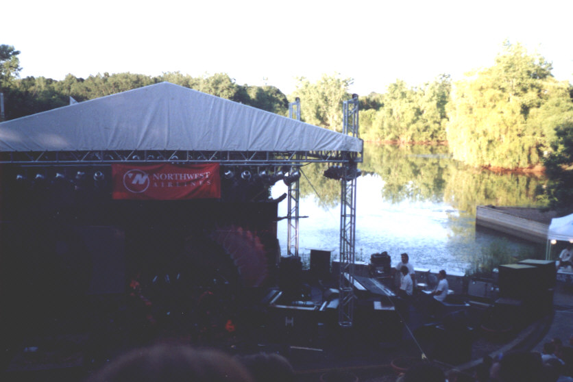 The stage, with trees and lake in background.