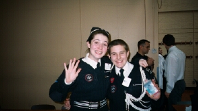 A picture of Nat and Nick with people in the background
