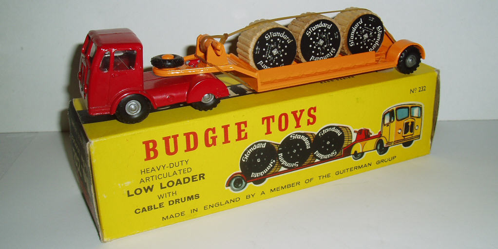 Rarity 2. Budgie 232 Seddon Low Loader 1960-66. This is the second version with lats added to the trailer to stop the drums sliding off. The wheel hubs have changed to silver. This one still retains its elastic band loading strap.