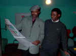 Ex NUS Financial Secretary with Cajethan Nwodo admiring the calendar