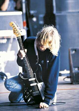 cobain holding guitar