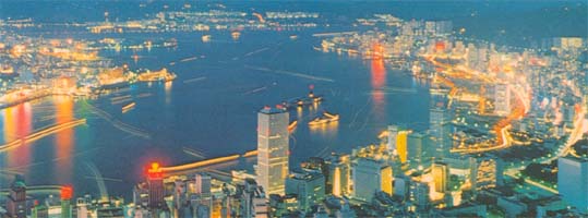 Connaught Center (with red aircraft warning lights) overlooking the Victoria harbour