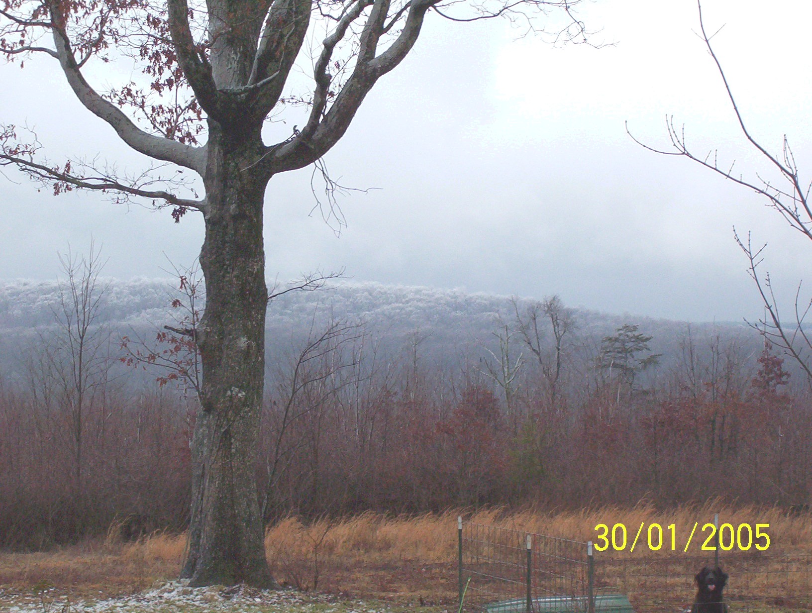 view of mountains off porch in winter snow