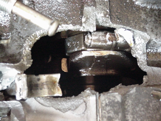 This is a little closer in look at the hole. You can see the end of the connectiong rod real well to the left.