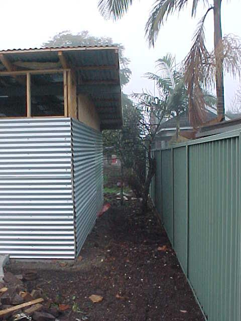 west side of garage with levelled passage