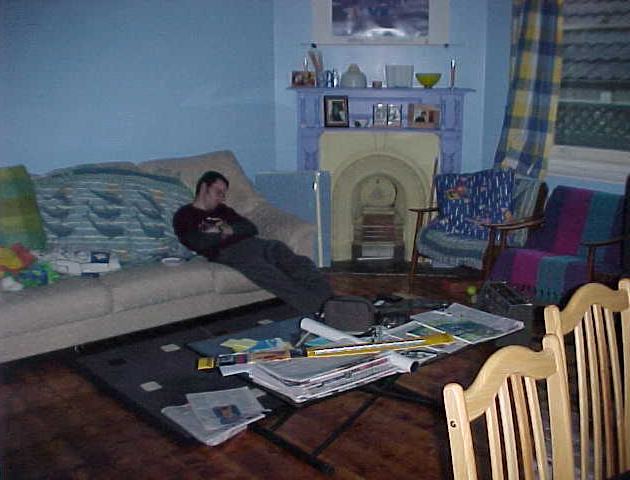 Ben exhausted after a long weekend - note the couch from his parents