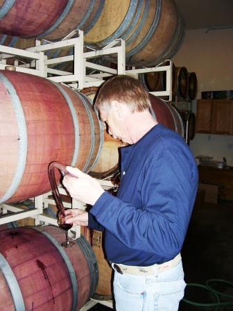 Rob Bell in the barrel room pulling samples