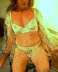 Plastic mac, bra and panties.