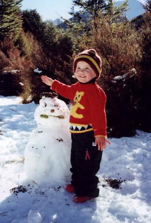 Caitlin finishes another snowman