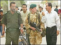 Ex regime members are patrolling with UK soldiers