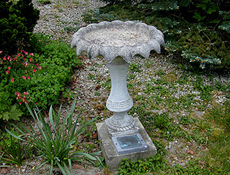 A birdbath dedicated in someone's name.