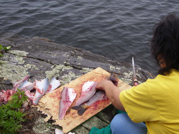 Gladys preparing fish