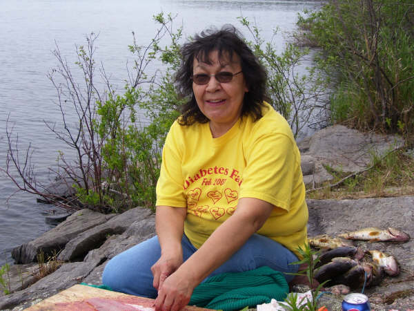 Gladys preparing fish