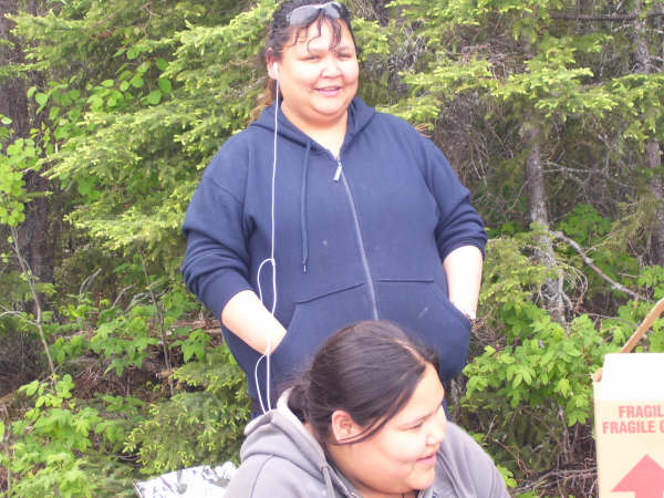 Two young ladies waiting for their fish to be fried, as so they could devour them
