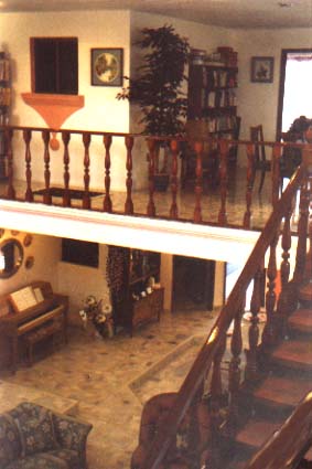THIS IS A VIEW OF THE HALL BALCONY AND STAIRCASE