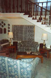 THIS VIEW SHOWS THE LIVINGROOM AND THE STAIRCASE