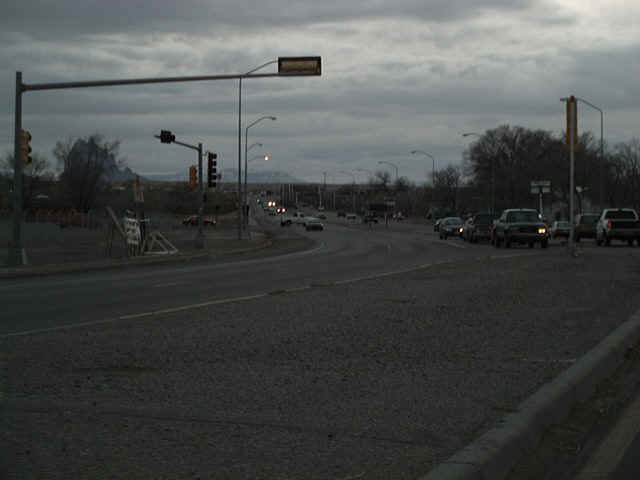Downtown midday traffic on an overcast day....there's that Rock thing in the background