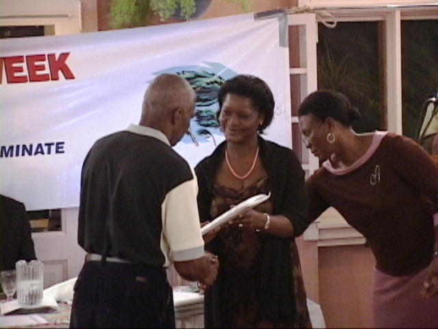 Divisional Fire Officer (DFO) Harvey Hendrickson receiving "Fire Services" award during Disaster Awareness Week 2005