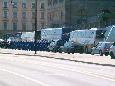 Marching band amid tourist busses