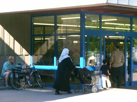 Shoppers from migrant family