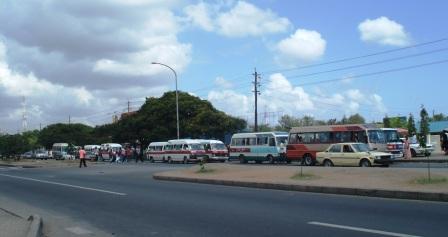 vehicles behind pedestrian barrier