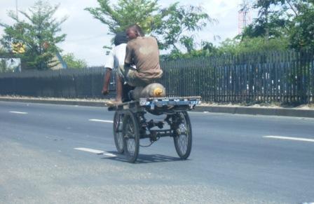 Guta, passenger sitting on gas cylinder