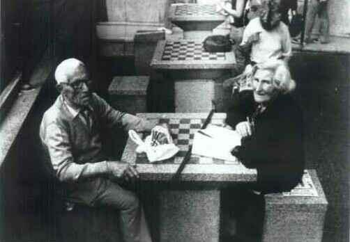 Old marriage seated to the chess table