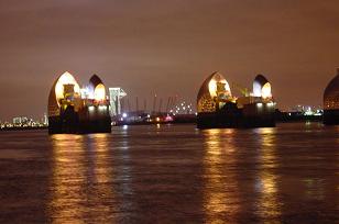 Thames Barrier at night, with Millennium Dome in the background, LONDON