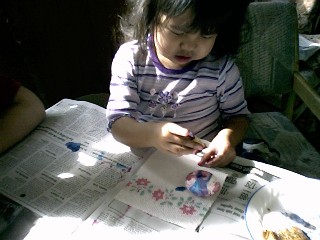 Sienna colouring eggs