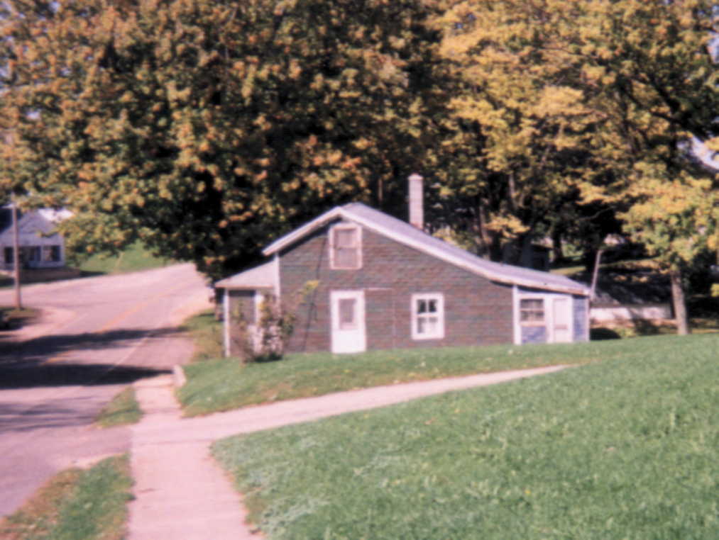 Despite the modern siding and other improvements, 
his home's classic lines indicate it is probably one of Wiota's older dwellings.
(Credit: Robert A. Braun.)