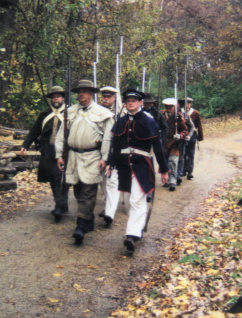 Militia march during the 'Fall Militia Muster and Training Days,' Lincoln's New Salem, November 2002.
(Credit: Mary S. Braun.)