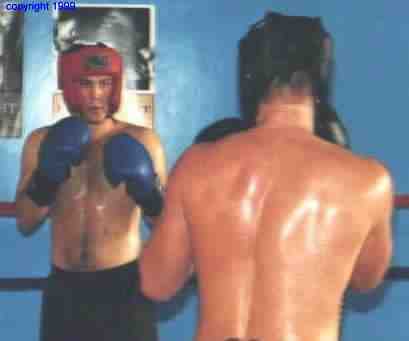 Boxers assume engarde position at start of the round.&nbsp; Photo copyright 1999.&nbsp; All rights reserved.