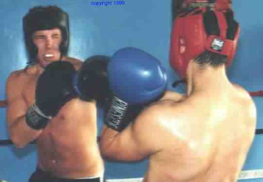 The point of sparring is practice.&nbsp; Keeping good form until it becomes instinct.&nbsp; Photo copyright 1999.&nbsp; All rights reserved.