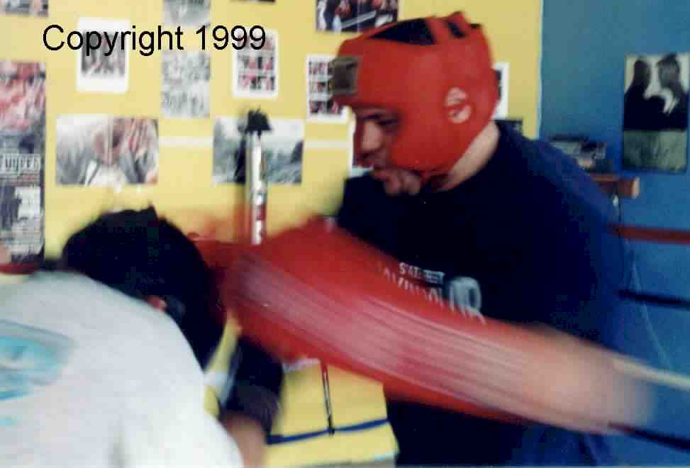 Coach working with boxer in preparation for competition.&nbsp; Copyright 1999.&nbsp; All rights reserved.