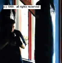 Boxer approaches heavy bag in the engarde position at the start of a four round workout.&nbsp; Copyright 1999.&nbsp; All rights reserved