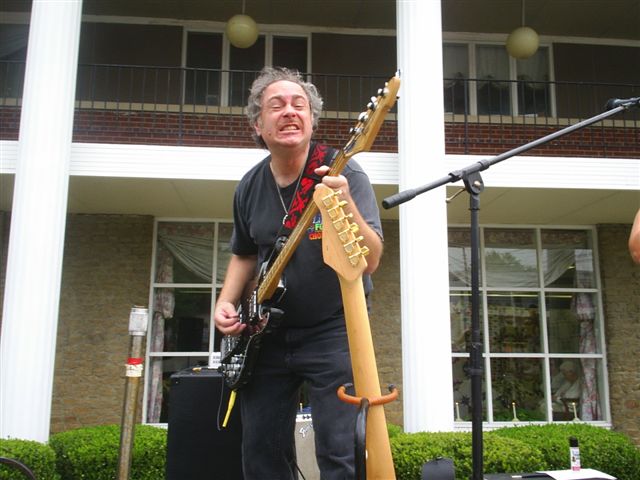 Arlin with his rock guitarist face while playing bass.