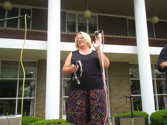 Lyn banging her tambourine.