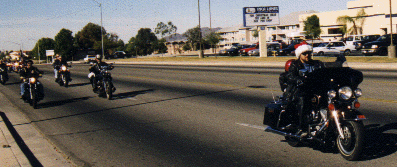 Picture of MC Knight and Son in a Toy Run.&nbsp; The little red helmet in the back seat is actually on a kid.