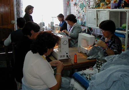 The sewing workshop crammed into the nursery to work on orders.