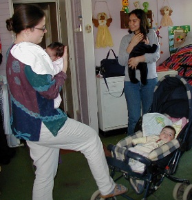 In the childcare center at Casa Ursulina with my hands (and feet!) full.
