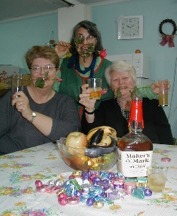 Suzanne, Cecilia and Mimi celebrate the end of a successful day with good ol' Kentucky bourbon, chocolate and roses.