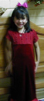 Showing off her new birthday dress sent by her godmother, Dianna Ortiz.