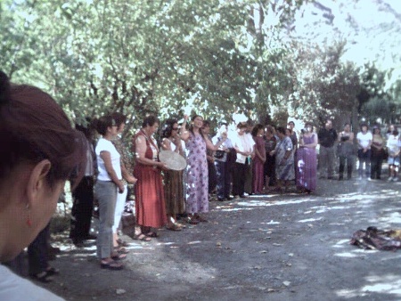 Maruja leads the group in a ritual of welcoming and blessing for the new center.