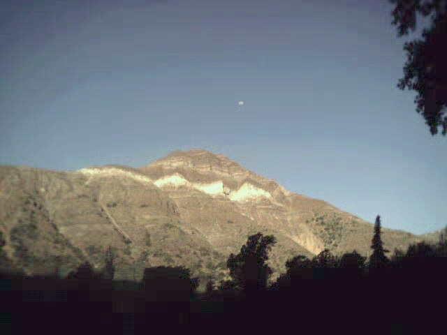 A view of the mountain and 3/4 moon from the town of San Alfonso, in the Caj�n del Maipu.