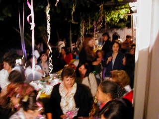113 women somehow fit into the back patio for this party.
